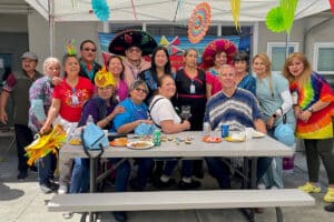 A group of employees at a party at All Saints