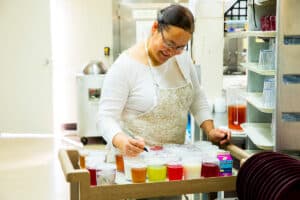 A chef cooking at All Saints