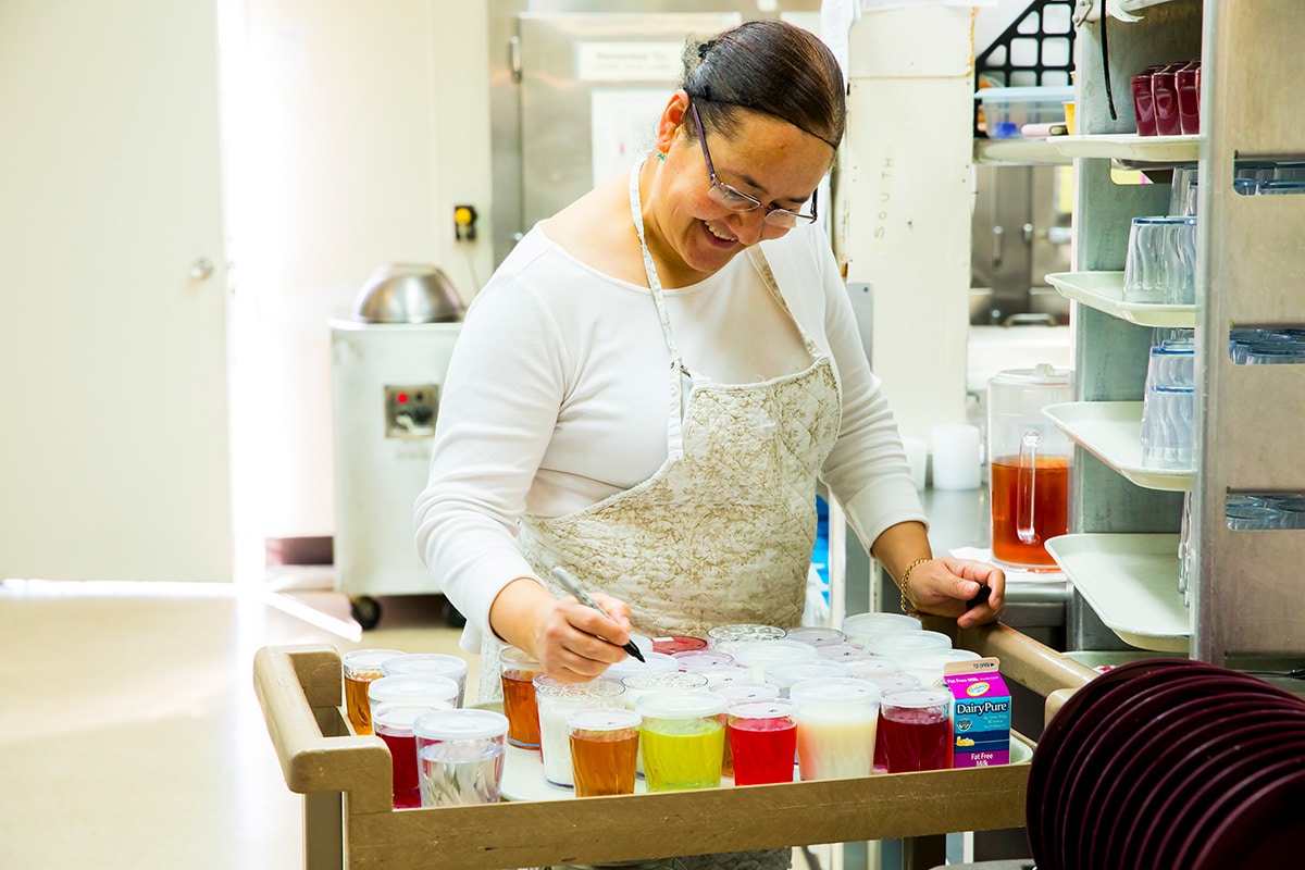A chef cooking at All Saints