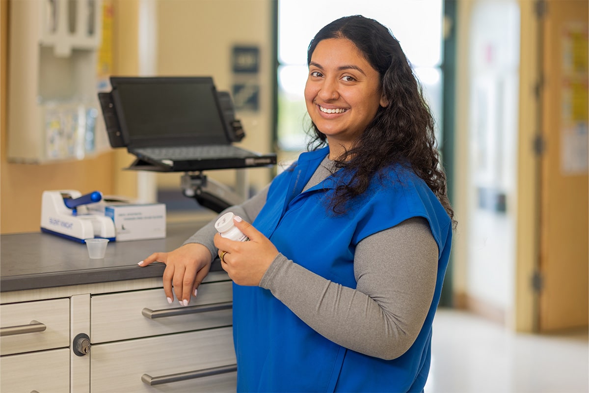 All Saints Post Healthcare nurse at the computer